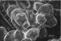Quasicrystals of an alloy of aluminum, copper, and iron, displaying an external form consistent with their icosahedral symmetry
