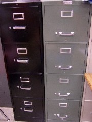 A tall metal filing cabinet for work or home use.