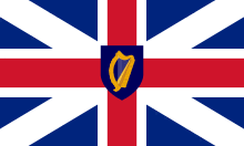 Red cross with a white border over a white saltire and dark blue background. At the centre is a gold harp in dark blue shield, which is the same size as the intersection of vertical and horizontal white bars.