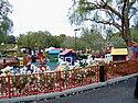 Old-fashioned roses line the walkways by a Lego toddler play area called Duplo Playtown.jpg