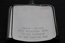A modern engraved hip flask