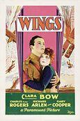 The theatrical poster of a movie. It focuses on two people. The man is wearing an aviator suit and the woman is wearing a blue jacket and red gloves.