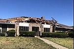 EF1 damage example -- Sections of roofing are removed from the home, leaving the internal decking exposed.