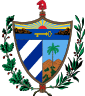 A shield in front of a Fasces crowned by the Phrygian Cap, all supported by an oak branch and a laurel wreath