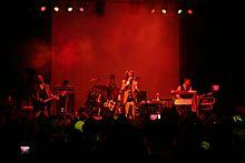 A photo of Nivek Ogre performing with ohGr in 2011.