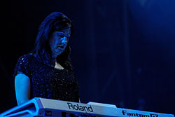 Gilbert on stage with New Order at Fête de l'Humanité in 2012