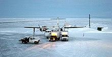 Unloading cargo from a First Air ATR 42 at Clyde River Airport.jpg