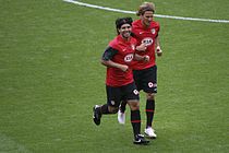 Teammates Sergio Agüero and Diego Forlán training at the Emirates Stadium side-by-side.