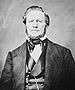 Portrait of a well-dressed nineteenth-century man, sitting.