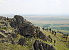 Rocky summit of Bear Butte and view over the Dakota plains.