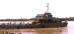 The large landing craft NRP Alfange supplying the garrison of Bambadinca 1973. In the Portuguese Colonial War, village was an important Portuguese base