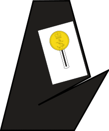 A piece of white cloth on the lapel of a blue dress coat.