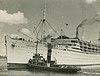 Passenger ship Stratheden being turned in the Brisbane River by the tugboat Carlock (4603281584).jpg