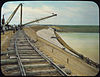 Belle Fourche Project - Dam, Upstream Face - placing the paving - South Dakota - NARA - 294654.jpg
