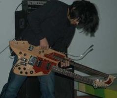 Masahiko Ohno performing live with one of his home made guitars