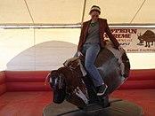 Woman riding mechanical bull.jpg