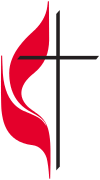 Flames licking around a simple black cross