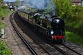 A 34046 Braunton travelling through Farncombe, Surrey (2016).jpg