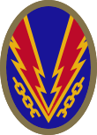 Oval shaped shoulder patch with a deep blue background. Lightning bolts break a yellow chain, representing the liberation of Nazi-occupied Europe.