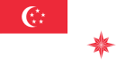 A red rectangle at the top left corner of the flag, charged with a white crescent and five white stars arranged in a pentagon. The rest of the flag is coloured white. At the bottom right part of the flag is an eight pointed star that is red.