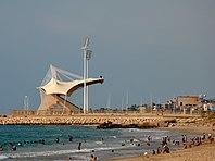 Saida International Stadium with beachgoers.jpg