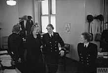 MRS WINSTON CHURCHILL VISITS WRNS HEADQUARTERS. SEPTEMBER 1941, QUEEN ANNE'S MANSIONS. MRS V LAUGHTON MATHEWS, DIRECTOR, WRNS, INTRODUCED MRS CHURCHILL TO EACH OFFICER IN CHARGE OF THE VARIOUS DEPARTMENTS AT TH A5490.jpg