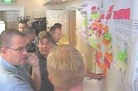 Intense discussion during a programme compression workshop.jpg