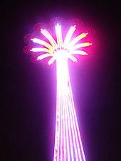 Purple lights on the Parachute Jump at night