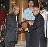 Pranab Mukherjee presenting the Sangeet Natak Akademi Fellowship to Shri Mahesh Elkunchwar, at the investiture ceremony of the Sangeet Natak Akademi Fellowships and Sangeet Natak Akademi Awards-2013, at Rashtrapati Bhavan.jpg