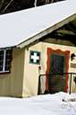 aid station - (military) a station located near a combat area for giving first aid to the wounded