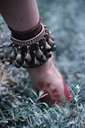 ankle bracelet - an ornament worn around the ankle