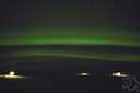 auroral - of or relating to the atmospheric phenomenon auroras