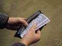 monetary system - anything that is generally accepted as a standard of value and a measure of wealth in a particular country or region