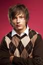 argyle - a design consisting of a pattern of varicolored diamonds on a solid background (originally for knitted articles)