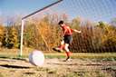 association football - a football game in which two teams of 11 players try to kick or head a ball into the opponents' goal