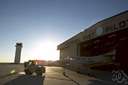 airdock - a large structure at an airport where aircraft can be stored and maintained