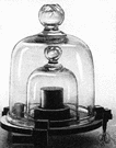 bell glass - a bell-shaped glass cover used to protect and display delicate objects or to cover scientific apparatus or to contain gases