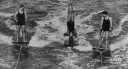 aquaplane - a board that is pulled by a speedboat as a person stands on it and skims over the top of the water aquaplane - a board that is pulled by a speedboat as a person stands on it and skims over the top of the water