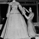 costumier - someone who designs or supplies costumes (as for a play or masquerade)