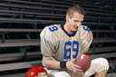 American football game - a game played by two teams of 11 players on a rectangular field 100 yards long