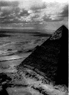Great Pyramid - a massive monument with a square base and four triangular sides