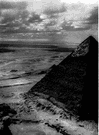 Pyramids of Egypt - a massive monument with a square base and four triangular sides