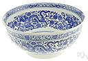 willow-pattern - chinaware decorated with a blue Chinese design on a white background depicting a willow tree and often a river