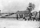 carriage house - a small building for housing coaches and carriages and other vehicles