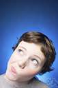 bemused - perplexed by many conflicting situations or statements