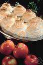 baked Alaska - cake covered with ice cream and meringue browned quickly in an oven
