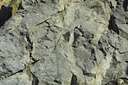 bedrock - solid unweathered rock lying beneath surface deposits of soil