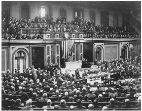 President Woodrow Wilson addresses a joint session of the 64th Congress on February 26, 1917, with a request to arm U.S. merchant ships. LIBRARY OF CONGRESS