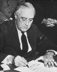 On December 8, 1941, President Franklin Delano Roosevelt signs the Congressional Declaration of War on Japan. NATIONAL ARCHIVES AND RECORDS ADMINISTRATION