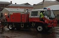Three NSW RFS tankers help to pump as much water from the closed storm water system into the Murrumbidgee River (1) (cropped).jpg